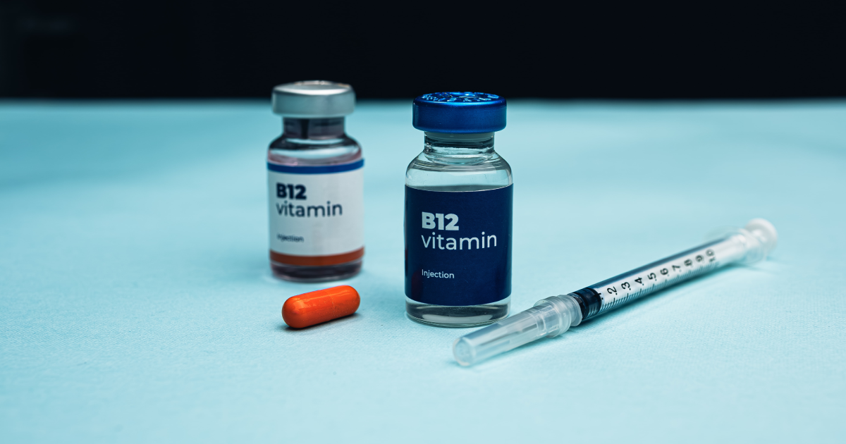 B-12 Injections vials, capsule, and syringe on a blue surface in Prescott Valley AZ